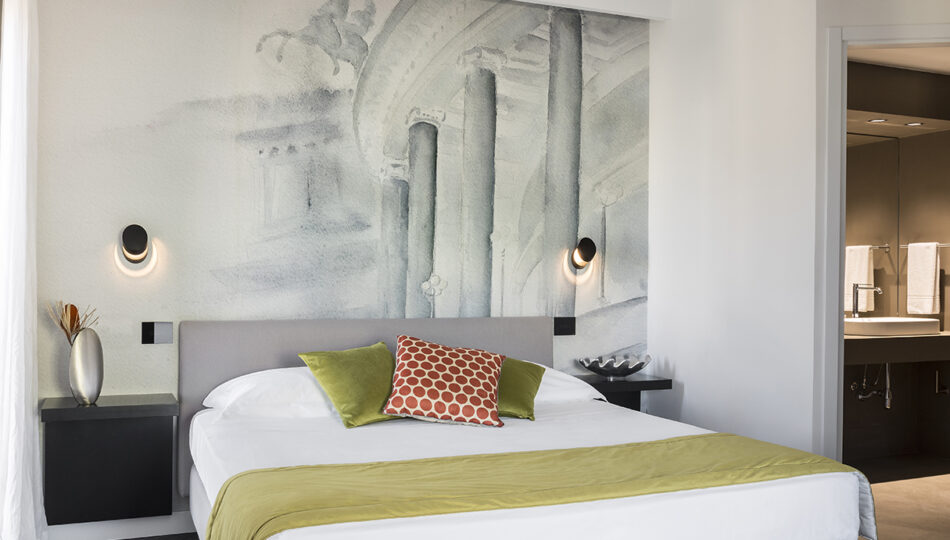 corallo suite bedroom with artist wallpaper hotel plaza opera